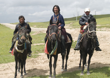 Mongolian nomads on horseback